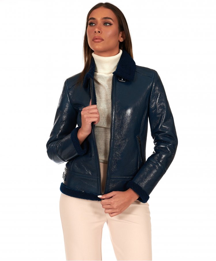 Blue lamb shearling biker jacket buckles and central zipper